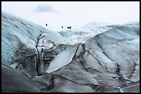 Distant hikers on Root Glacier from below. Wrangell-St Elias National Park ( color)