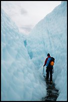 Hiker in narrow canyon, Root glacier. Wrangell-St Elias National Park ( color)