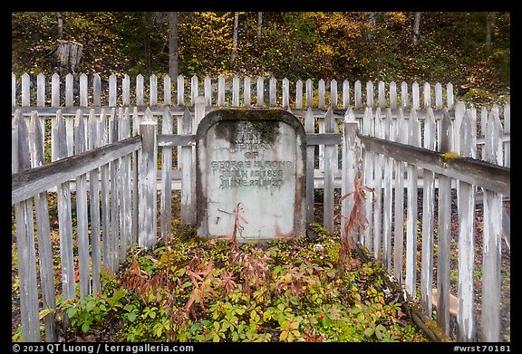 Headstone and white picket fences, Kennicott cemetery. Wrangell-St Elias National Park, Alaska, USA.