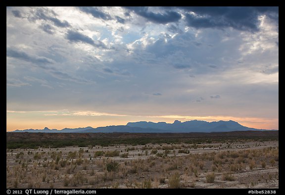 Dry riverbed, distant Chisos Mountains, and clouds. Big Bend National Park (color)