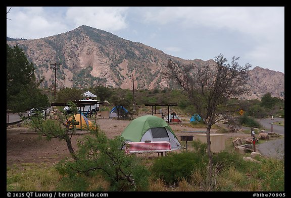 Scattered tents, vans, and picnic shelters dot Chisos Basin Campground. Big Bend National Park (color)