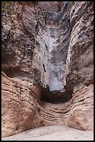 Sheer canyon walls streaked with mineral stains frame a dry Burro Mesa pour-off. Big Bend National Park ( color)