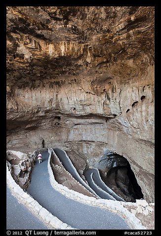 Tourist walking down natural entrance. Carlsbad Caverns National Park, New Mexico, USA.