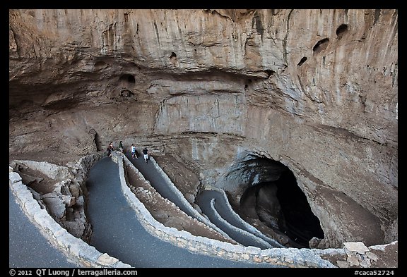 Tourists walking down natural entrance. Carlsbad Caverns National Park, New Mexico, USA.