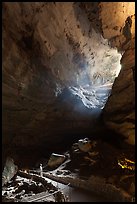 Visitor looking at natural entrance from below. Carlsbad Caverns National Park ( color)