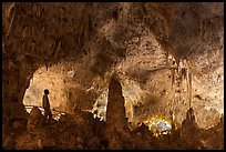 Park visitor looking, cave room. Carlsbad Caverns National Park, New Mexico, USA. (color)