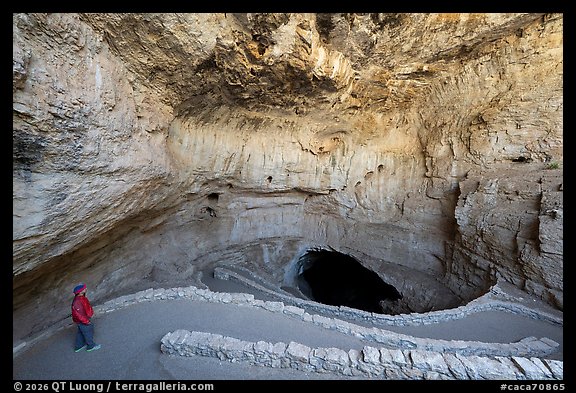 Visitor Looking, paved switchbacks into the natural entrance. Carlsbad Caverns National Park (color)