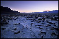 Evaporation patterns on salt flats near Badwater, dusk. Death Valley National Park, California, USA. (color)