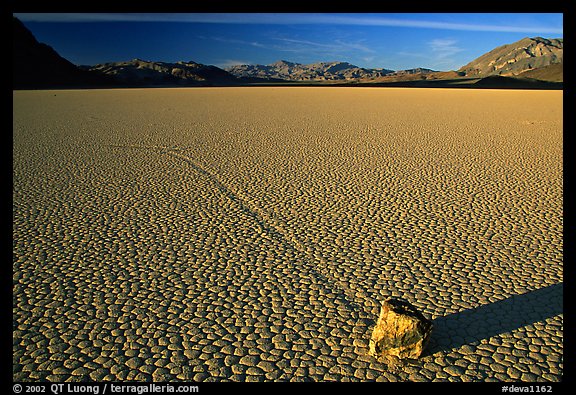 Tracks, moving rock on the Racetrack, late afternoon. Death Valley National Park (color)