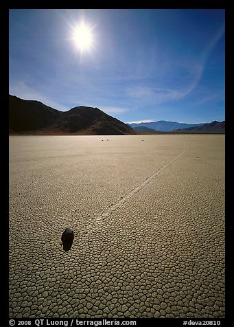 Tracks and moving rock on the Racetrack, mid-day. Death Valley National Park (color)