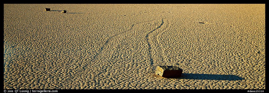 Moving stones on dried mud playa. Death Valley National Park (color)