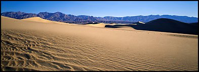 Landscape of sand dunes and mountains. Death Valley National Park (Panoramic color)