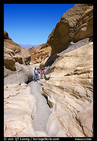 Hikers in narrows, Mosaic canyon. Death Valley National Park (color)