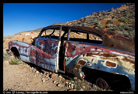 Car with bullet holes near Aguereberry camp, afternoon. Death Valley National Park (color)