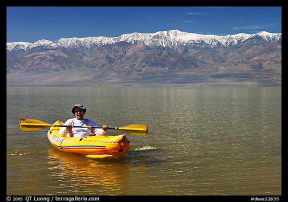 Kayaker padding ephemeral Manly Lake. Death Valley National Park (color)