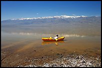 Kayaker near shore in Manly Lake. Death Valley National Park, California, USA.