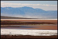 Salt Flats on Valley floor and Owlshead Mountains, early morning. Death Valley National Park, California, USA. (color)