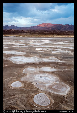 Salt evaporation patterns and Funeral Mountains at sunset, Cottonball Basin. Death Valley National Park (color)
