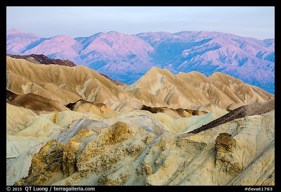Badlands and mountains at sunrise, Twenty Mule Team Canyon. Death Valley National Park (color)