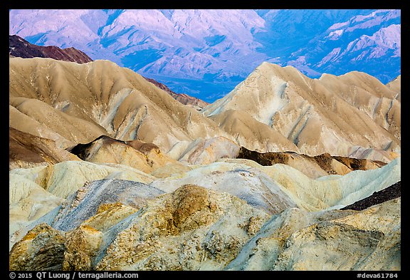 Badlands and mountain lighted by sunrise, Twenty Mule Team Canyon. Death Valley National Park (color)