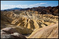 Visitor looking, Zabriskie Point. Death Valley National Park ( color)