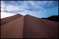 Dune ridges and mountains at sunset, Ibex Dunes. Death Valley National Park ( color)