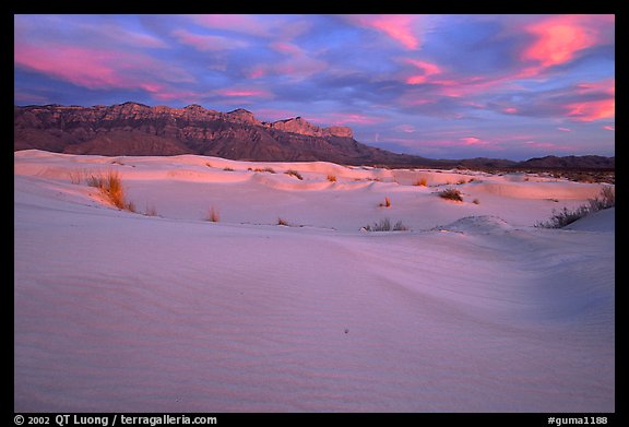 Gypsum sand dunes and Guadalupe range at sunset. Guadalupe Mountains National Park