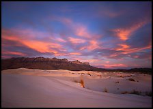 White sand dunes, Guadalupe range, and clouds at sunset. Guadalupe Mountains National Park, Texas, USA.