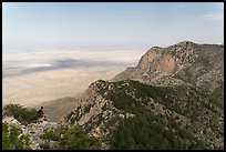 Hiker surveying view over mountains and plains. Guadalupe Mountains National Park ( color)