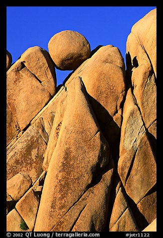 Spherical boulder jammed on top of triangular boulders, Jumbo rocks. Joshua Tree National Park (color)
