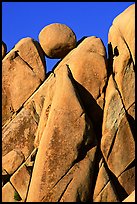 Spherical boulder jammed on top of triangular boulders, Jumbo rocks. Joshua Tree National Park ( color)