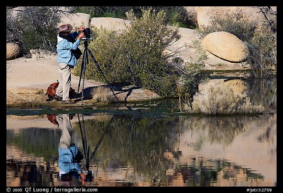 Photographer with large format camera at Barker Dam. Joshua Tree National Park (color)