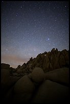 Marble rocks under clear starry sky. Joshua Tree National Park ( color)