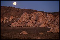 Moon rising about mountains. Joshua Tree National Park ( color)