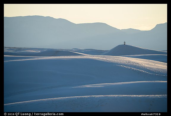 Photographer with tripod on tall dune at sunset. White Sands National Park (color)