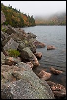 Rocky shore in autumn, Jordan Pond. Acadia National Park, Maine, USA.