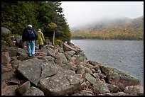 Hikers on shore of Jordan Pond. Acadia National Park, Maine, USA. (color)