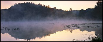 Fog rising of lake at dawn. Cuyahoga Valley National Park (Panoramic color)