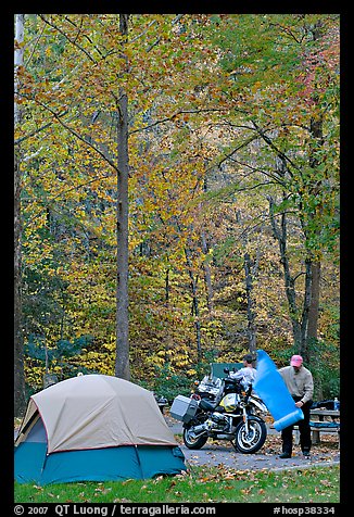 Tent and motorcycle camper under trees in fall colors. Hot Springs National Park, Arkansas, USA.