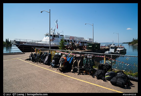 Backpacks lined up on dock, Rock Harbor. Isle Royale National Park (color)