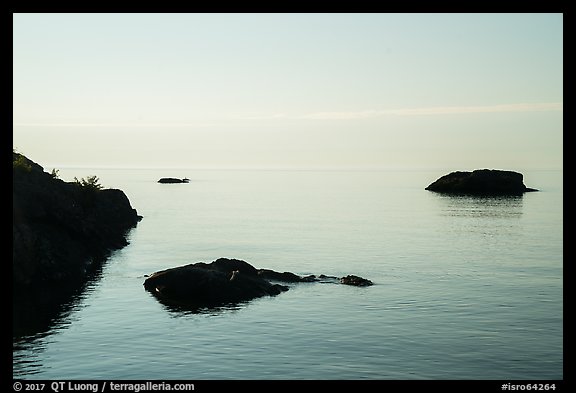 Dark rocks, early morning, Lake Superior. Isle Royale National Park, Michigan, USA.