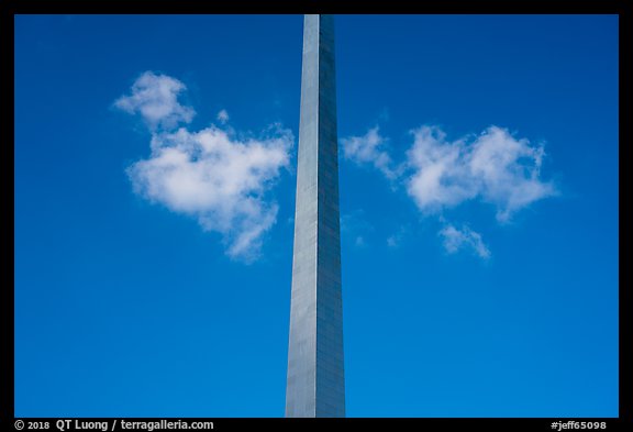 Symmetric view of Arch pillar with clouds and blue skies. Gateway Arch National Park, St Louis, Missouri, USA.