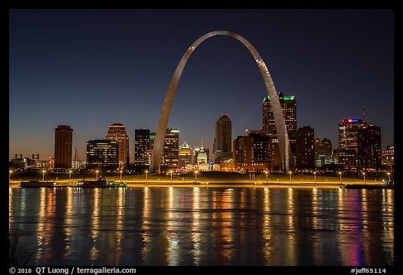 Arch, Old Courthouse and skyline reflected in Mississippi River at night. Gateway Arch National Park, St Louis, Missouri, USA.