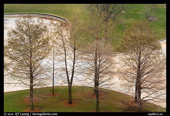 Bare trees and drained North Pond. Gateway Arch National Park, St Louis, Missouri, USA.