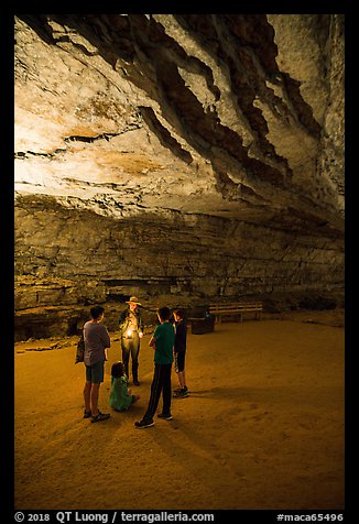 Ranger with lantern talks to family in cave. Mammoth Cave National Park (color)