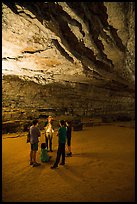Ranger with lantern talks to family in cave. Mammoth Cave National Park ( color)
