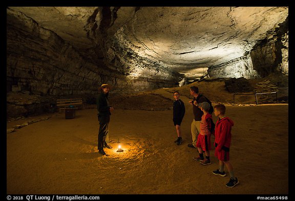Ranger talks to family in cave. Mammoth Cave National Park, Kentucky, USA.