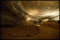 Visitors walk down huge corridor in cave. Mammoth Cave National Park ( color)