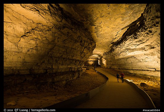 Couple walking down path in cave. Mammoth Cave National Park (color)