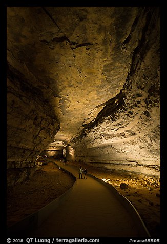 Visitors walk down path in cave. Mammoth Cave National Park, Kentucky, USA.